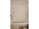 Shower with a new white tub at 15772 Stable Run Dr, Spring Hill, FL 34610