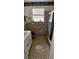 Classic bathroom featuring tiled walls, tub-shower combination, vanity, and a large window at 17932 Wendy Sue Ave, Hudson, FL 34667
