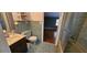 Retro bathroom featuring walk in shower, mosaic tiles and classic fixtures at 17932 Wendy Sue Ave, Hudson, FL 34667