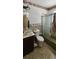 Bathroom featuring a shower-tub combo, toilet, vanity, and decorative tile at 17932 Wendy Sue Ave, Hudson, FL 34667
