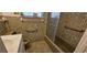 Vintage bathroom featuring mosaic tiles, a bathtub with shower, and neutral fixtures at 17932 Wendy Sue Ave, Hudson, FL 34667