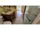 Updated bathroom featuring granite countertops and a glass shower at 17932 Wendy Sue Ave, Hudson, FL 34667