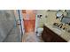 Updated bathroom with granite countertops and a glass enclosed shower at 17932 Wendy Sue Ave, Hudson, FL 34667