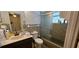 Bathroom features retro tile and a shower-tub combo at 17932 Wendy Sue Ave, Hudson, FL 34667