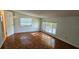 Cozy bedroom features natural light from a bay window and wood flooring at 17932 Wendy Sue Ave, Hudson, FL 34667