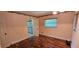 Bedroom with hardwood floors and natural lighting at 17932 Wendy Sue Ave, Hudson, FL 34667