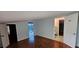 A bedroom with parquet floors, good natural light, and neutral walls at 17932 Wendy Sue Ave, Hudson, FL 34667