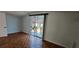 Bright bedroom featuring a sliding glass door for natural light at 17932 Wendy Sue Ave, Hudson, FL 34667