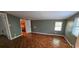 Bedroom with wood flooring, closet access and a bright window for natural light at 17932 Wendy Sue Ave, Hudson, FL 34667
