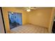 Bonus room with tiled flooring and backyard views through sliding glass doors at 17932 Wendy Sue Ave, Hudson, FL 34667