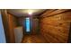 Wood paneled walk-in closet with wood flooring and built in shelving at 17932 Wendy Sue Ave, Hudson, FL 34667