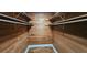 Walk-in closet featuring natural wood and built-in shelving at 17932 Wendy Sue Ave, Hudson, FL 34667