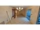 Dining room features tile floors, chandelier, and a glass sliding door at 17932 Wendy Sue Ave, Hudson, FL 34667