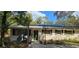 Front exterior view of a charming home, with lots of green shrubbery at 17932 Wendy Sue Ave, Hudson, FL 34667