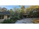 This house features an outdoor covered area perfect for outdoor living in a serene, wooded setting at 17932 Wendy Sue Ave, Hudson, FL 34667