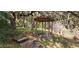 Rustic wooden gazebo featuring built-in benches and a cozy, shaded spot in the yard at 17932 Wendy Sue Ave, Hudson, FL 34667
