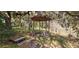 Rustic gazebo nestled among trees, offering a peaceful outdoor retreat at 17932 Wendy Sue Ave, Hudson, FL 34667