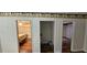 Hallway with beautiful hard wood floors leading to multiple rooms at 17932 Wendy Sue Ave, Hudson, FL 34667