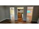 Hallway view with access to rooms, water heater and a closet at 17932 Wendy Sue Ave, Hudson, FL 34667