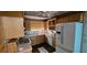 Functional kitchen with wooden cabinets, countertops, and standard appliances at 17932 Wendy Sue Ave, Hudson, FL 34667