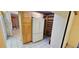 Kitchen with ample storage, tile flooring, and backyard access at 17932 Wendy Sue Ave, Hudson, FL 34667