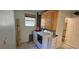 Laundry room featuring a washer and dryer, cabinets, and access to a bathroom at 17932 Wendy Sue Ave, Hudson, FL 34667