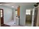 Laundry room with washer, dryer, and utility sink, with access to a bathroom at 17932 Wendy Sue Ave, Hudson, FL 34667