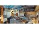 Expansive living room with exposed ceiling beams and an outdoor fountain at 17932 Wendy Sue Ave, Hudson, FL 34667
