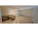 Living room with tile floors and sliding glass doors to outdoor area at 17932 Wendy Sue Ave, Hudson, FL 34667