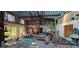 Large living room with high ceilings, glass windows, and access to an outdoor fountain at 17932 Wendy Sue Ave, Hudson, FL 34667