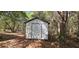 Outdoor storage shed offering practical space in a wooded yard at 17932 Wendy Sue Ave, Hudson, FL 34667