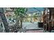 This sun room features a wooden floor, clear ceiling, and plenty of plants at 17932 Wendy Sue Ave, Hudson, FL 34667