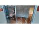 Sunroom featuring a wood ceiling, floors, furniture and an exterior view with a person reflected in the glass door at 17932 Wendy Sue Ave, Hudson, FL 34667