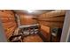 Utility room with wood paneled walls, wood floors, storage and mechanical components at 17932 Wendy Sue Ave, Hudson, FL 34667