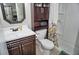 Bathroom features a vanity with drawers, a toilet, and a shower behind a patterned curtain at 20857 Haulover Cv # B15, Lutz, FL 33558