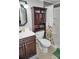 Bathroom features a vanity with drawers, a toilet, and a shower behind a patterned curtain at 20857 Haulover Cv # B15, Lutz, FL 33558