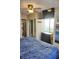 Comfortable bedroom featuring a dresser, mounted TV, view to a window, and mirrored closet at 20857 Haulover Cv # B15, Lutz, FL 33558