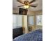 Inviting bedroom features mounted tv, ceiling fan, window views and mirrored closet at 20857 Haulover Cv # 15, Lutz, FL 33558