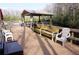 Community dock with seating and a covered area for residents to enjoy the lakeside view at 20857 Haulover Cv # B15, Lutz, FL 33558