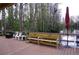 Community dock with benches and an umbrella near the lake, creating a perfect spot for relaxation at 20857 Haulover Cv # B15, Lutz, FL 33558