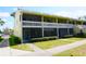 Charming two-story condo with screened-in porch, balcony, and well-maintained landscaping at 20857 Haulover Cv # B15, Lutz, FL 33558