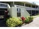 Well-manicured condo complex featuring a smoke-free community and vibrant foliage at 20857 Haulover Cv # B15, Lutz, FL 33558