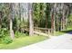Wooden foot bridge surrounded by lush greenery and trees at 20857 Haulover Cv # B15, Lutz, FL 33558