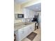 Clean and bright kitchen featuring white cabinets, granite counters, and modern appliances at 20857 Haulover Cv # B15, Lutz, FL 33558