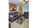Inviting living room featuring a comfortable dark brown leather sofa and decor at 20857 Haulover Cv # B15, Lutz, FL 33558