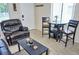 Cozy living area features tile floors, comfortable seating, and a dining table at 20857 Haulover Cv # B15, Lutz, FL 33558