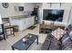 Cozy interior featuring a comfortable sofa and an adjacent modern kitchen at 20857 Haulover Cv # 15, Lutz, FL 33558