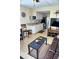 Cozy interior featuring a comfortable sofa and an adjacent modern kitchen at 20857 Haulover Cv # B15, Lutz, FL 33558