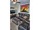 Inviting living area with a dark leather sofa and a wall-mounted television at 20857 Haulover Cv # B15, Lutz, FL 33558