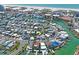 Aerial shot highlighting the waterfront home's convenient location, nearby beach access, and boating opportunities at 291 115Th Ave, Treasure Island, FL 33706